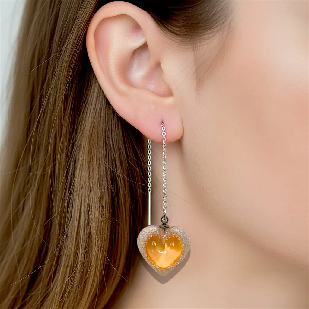 boucles d’oreilles cœur voronoï orange portées